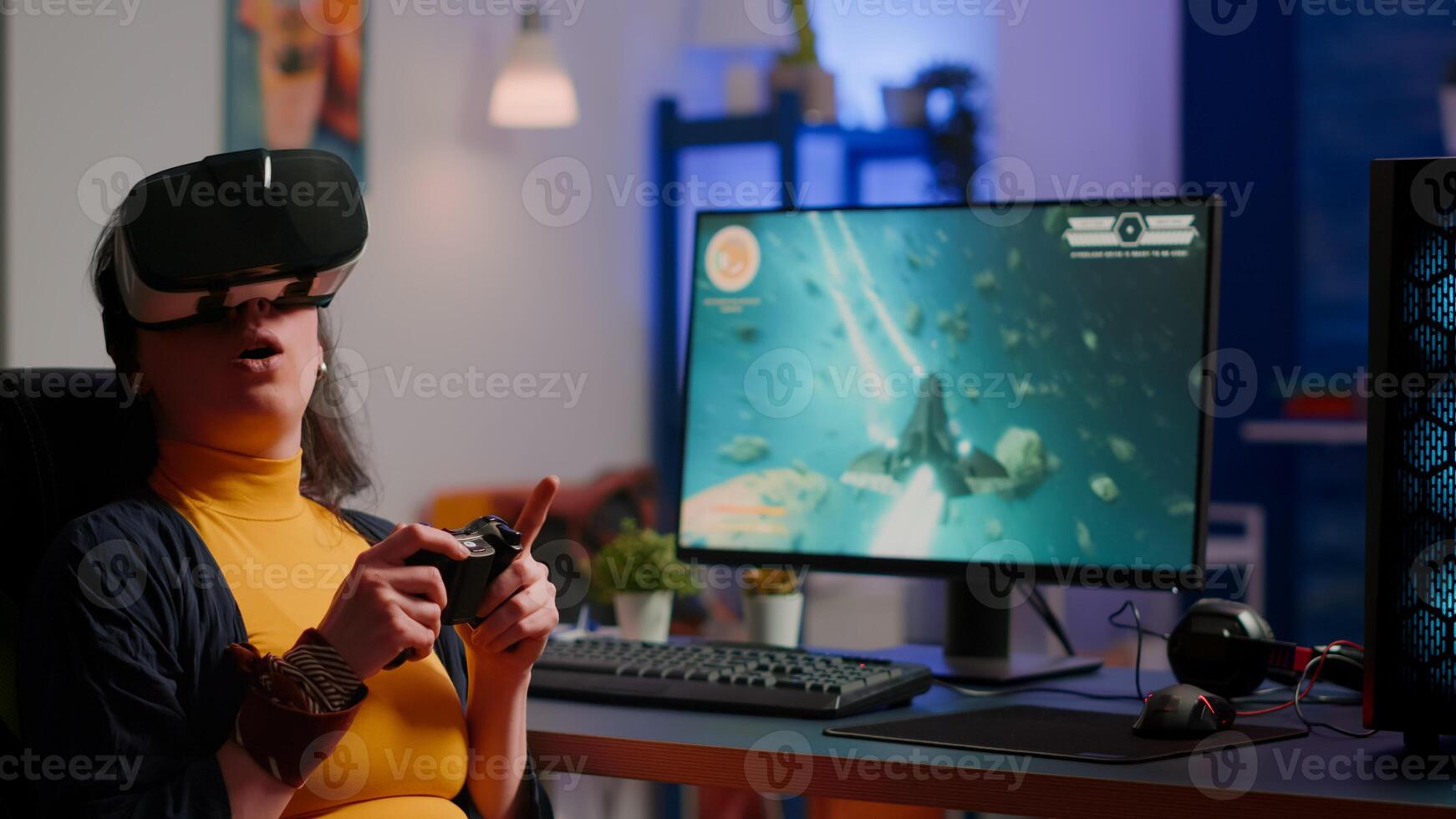 Player woman wining space shooter game using virtual reality goggles playing games with modern joystick. Professional cyber gamer streaming online games with new graphics on powerful computer photo