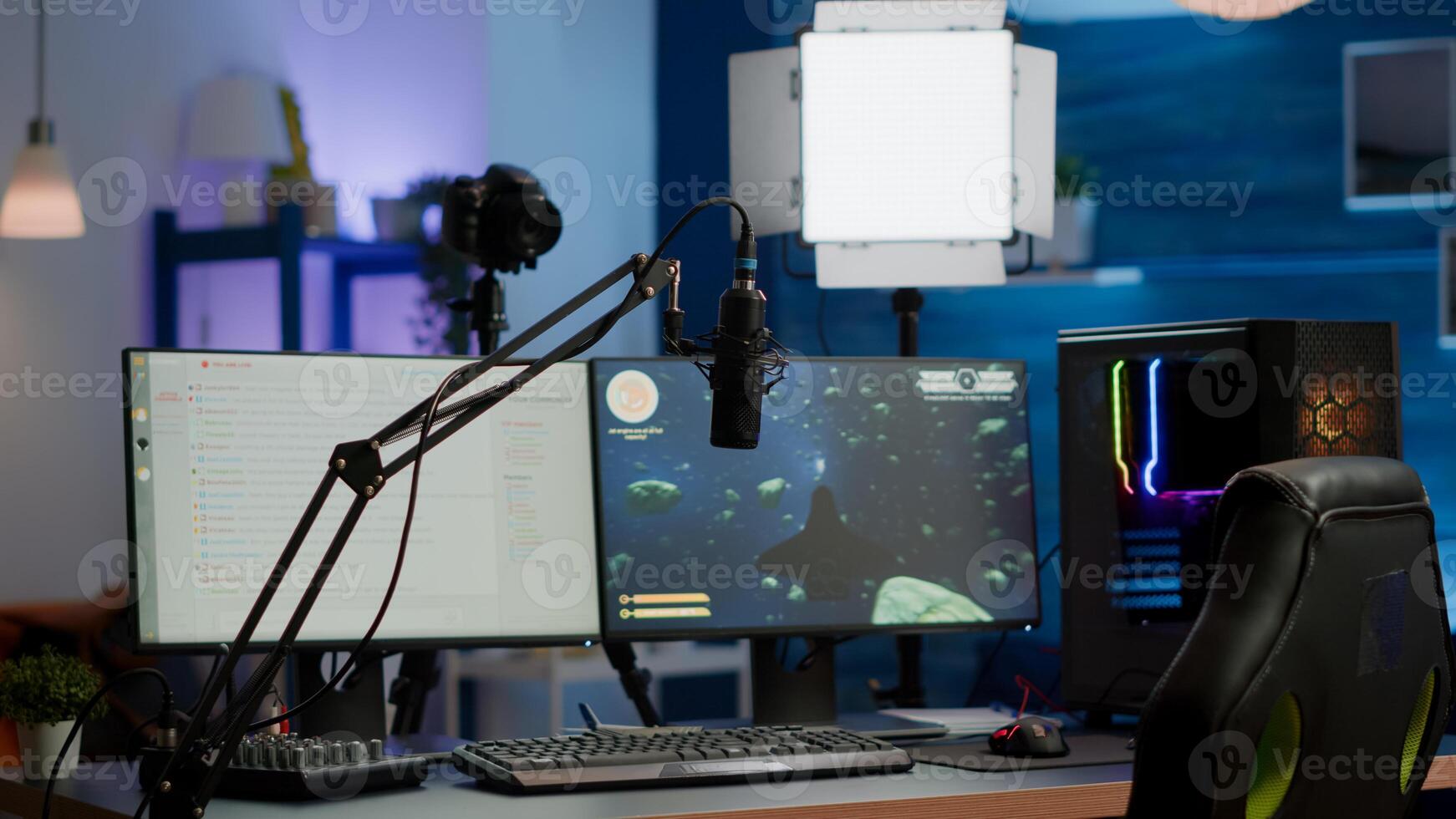 Empty gaming studio with RGB led lights powerful personal computer for streaming online competition. Display with stream chat prepared for virtual tournament, living room with nobody in photo