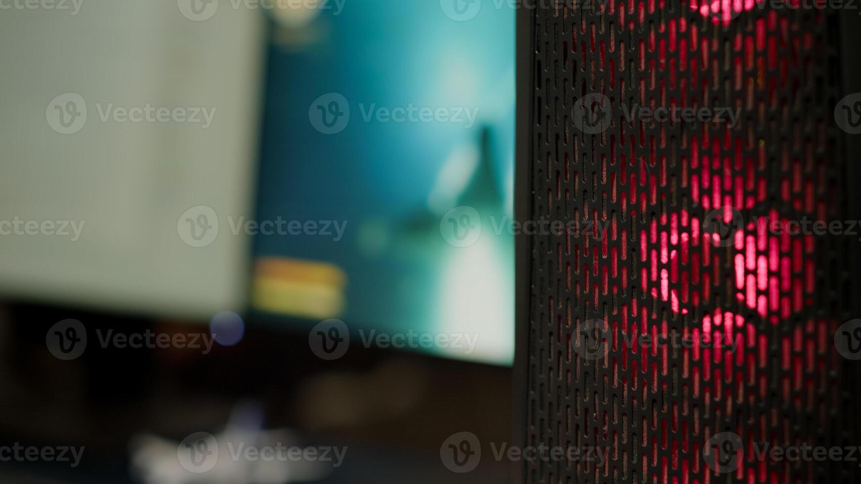 Close up of RGB system desktop prepared for e sport online tournament. Powerful personal computer for online videogames with space shooter game on screen. Cozy gaming room with modern design photo
