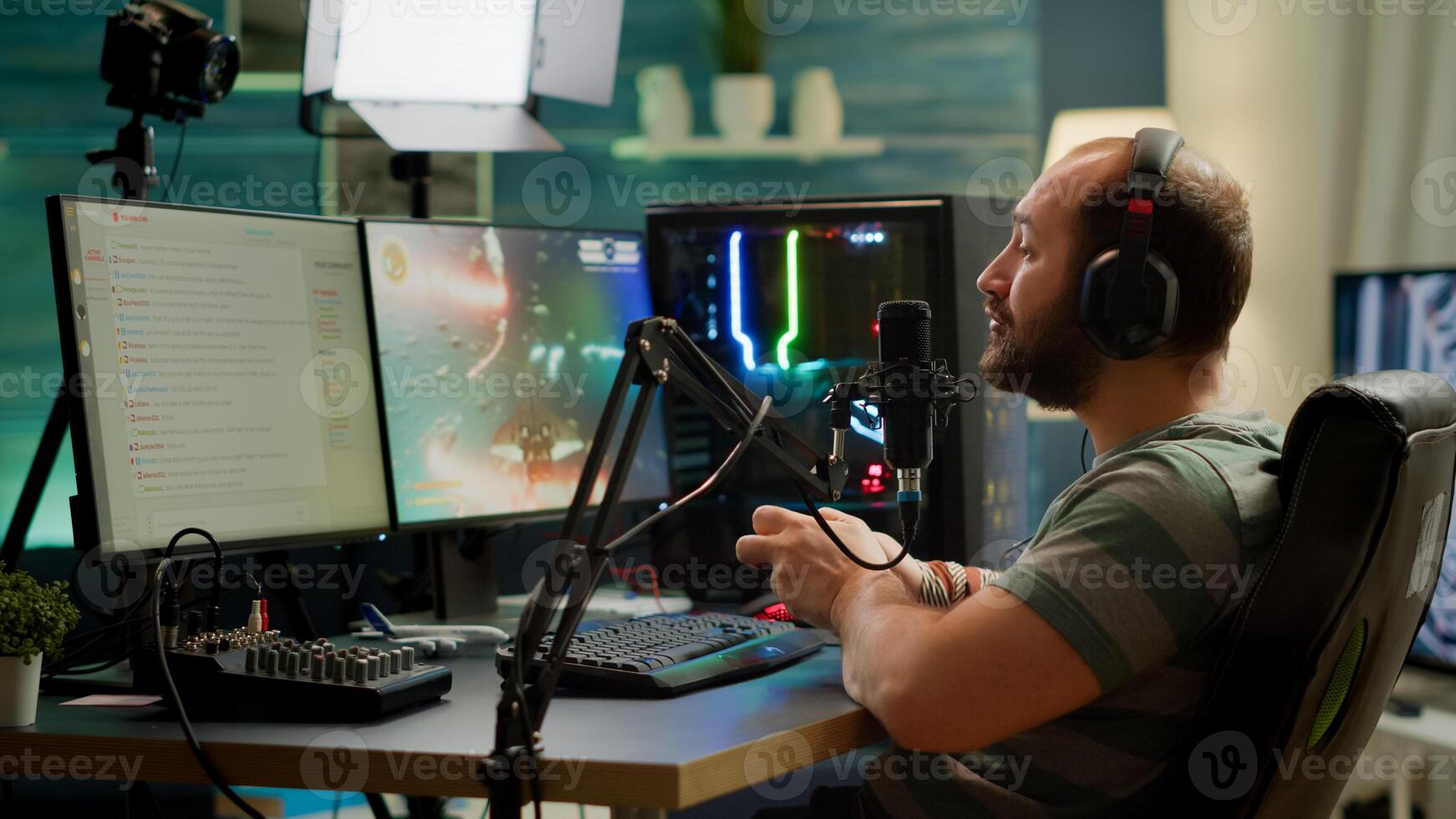 Pro cyber streamer losing videogame tournament while wearing professional headset holding wireless controller. Defeated gamer using joystick for online competition late at night in gaming room photo