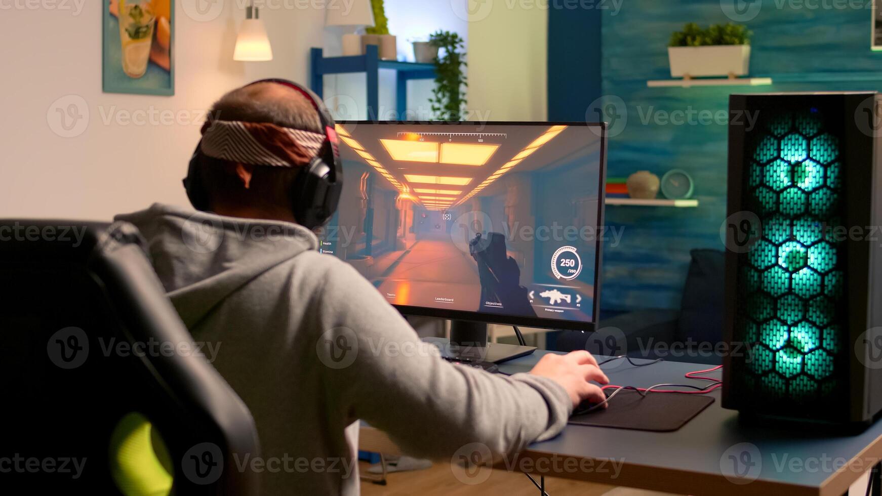 Addicted game r performing cyber games using professional headphones in gaming room. Competitive gamer playing game tournament with new graphics on powerful computer. photo