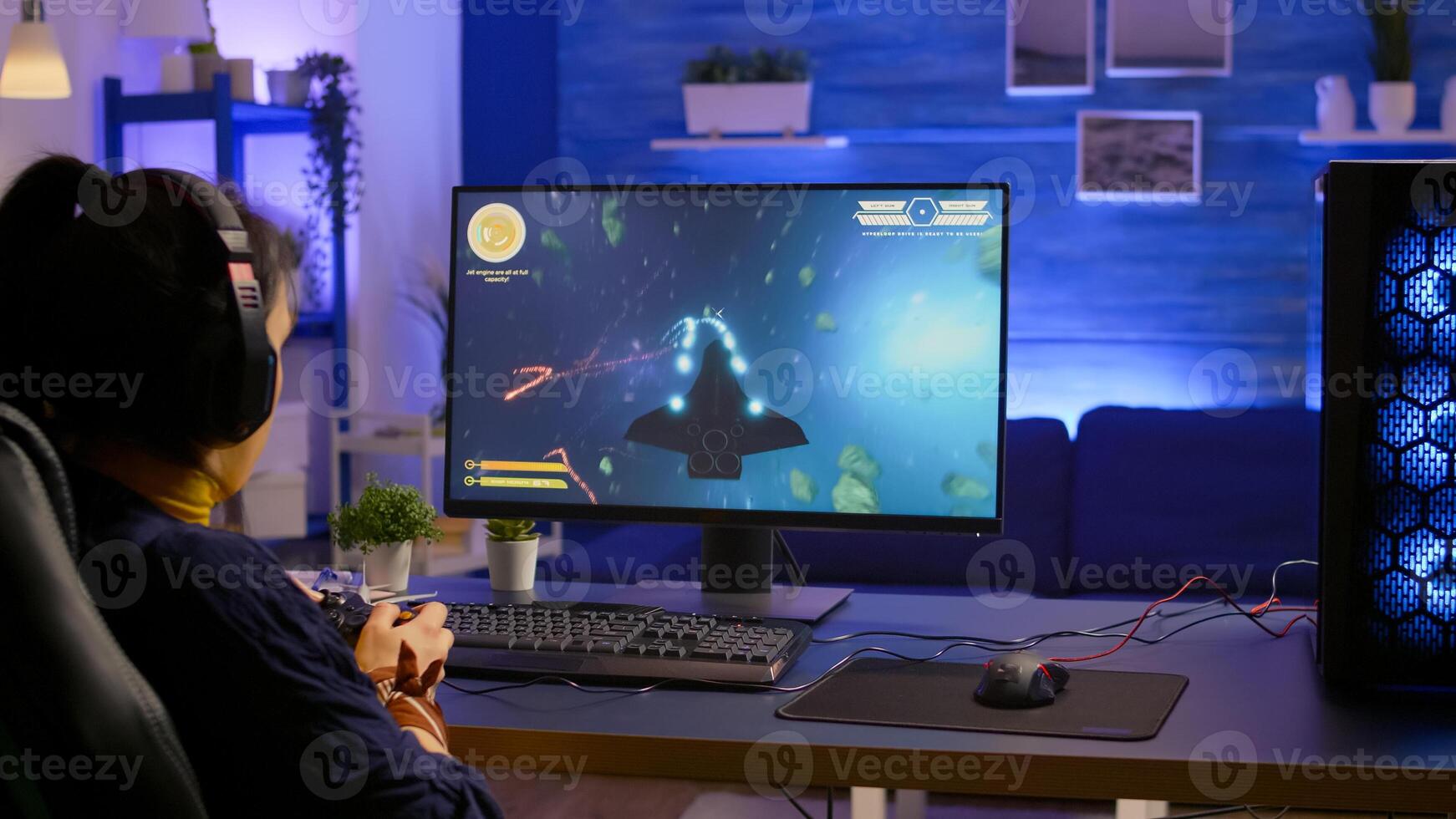 Pro gamer playing space shooter online championship with modern graphics using wireless controller. Competitive player streaming game tournament using professional equipment at gaming studio photo