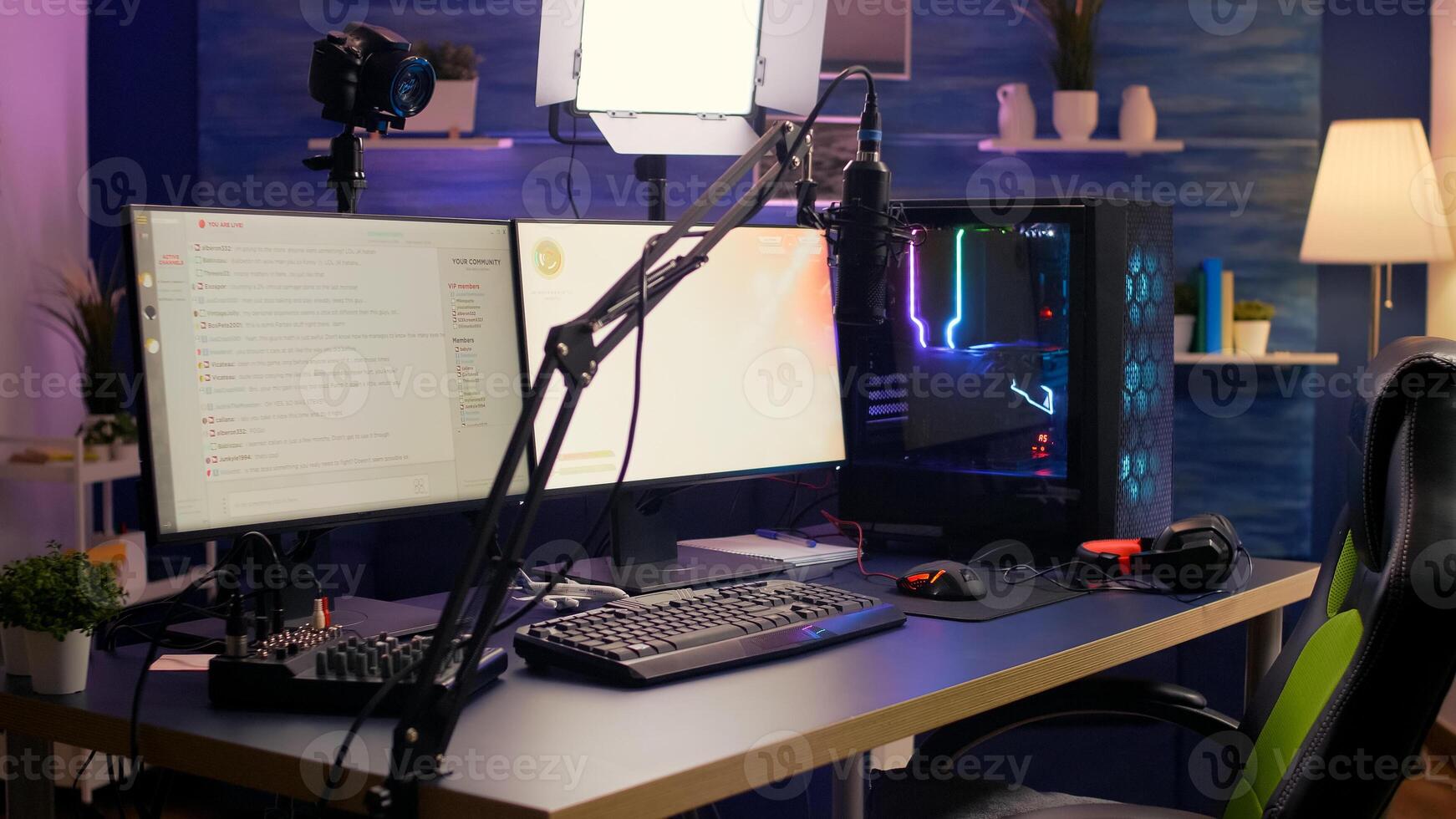 Empty streaming home studio equipped with professional streaming equipment. Pro streamer losing space shooter game during online tournament late at night in gaming studio photo