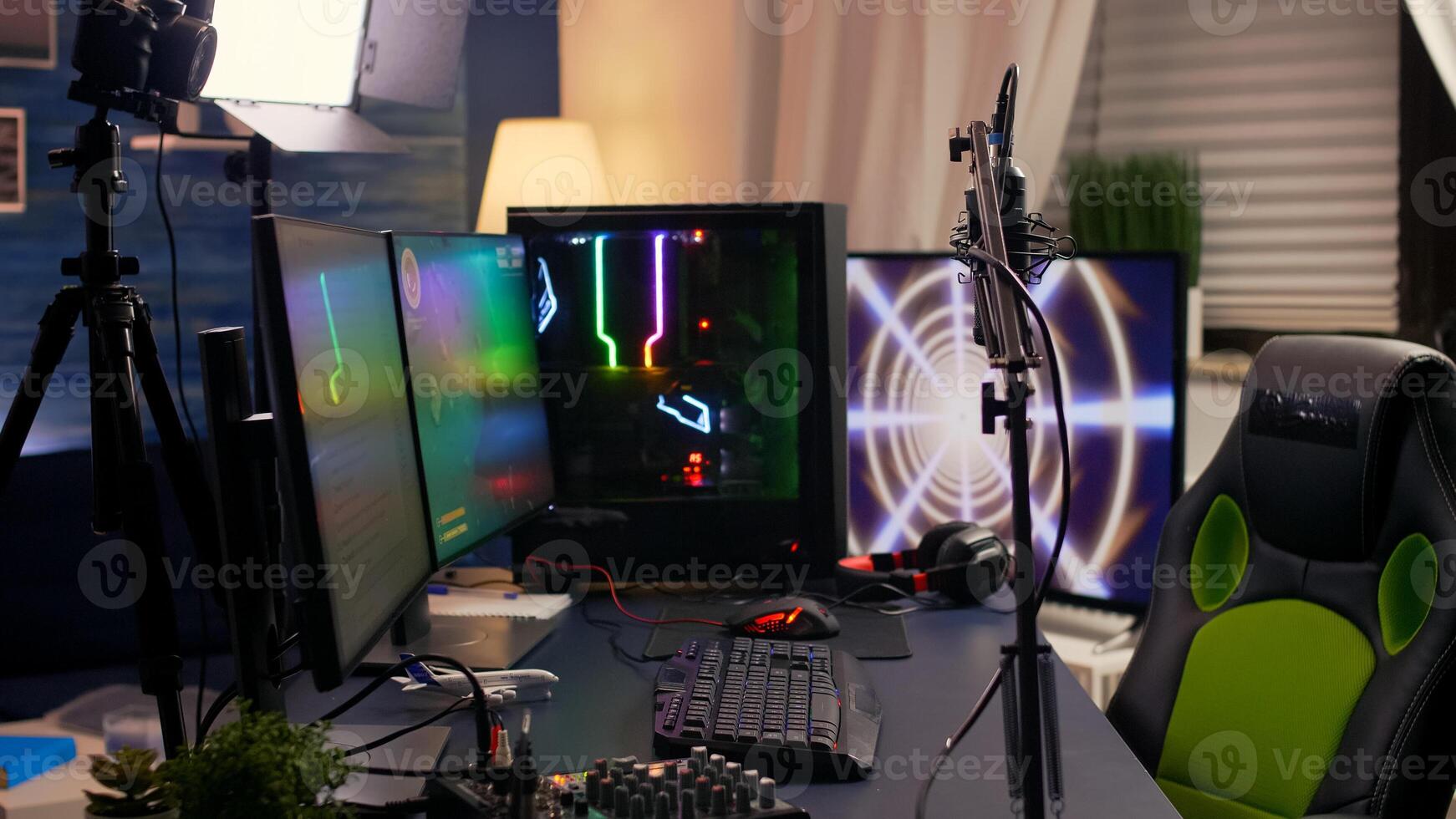 Slide view of streaming home studio equipped with professional equipment during esport competition. Gamer playing space shooter games late at night photo