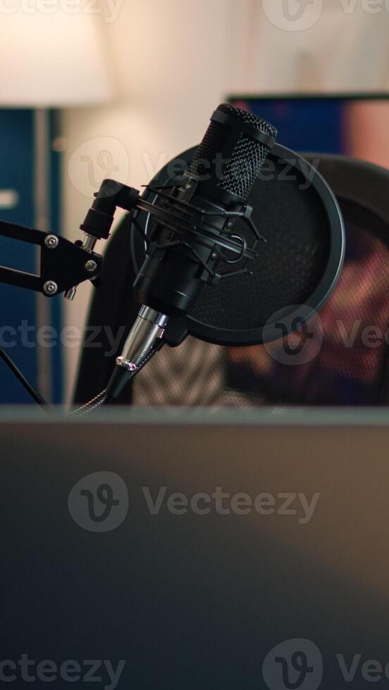 Podcast home studio in living room with professional brodcasting gear with nobody in it. Influencer recording social media content with production microphone, digital web internet streaming station photo