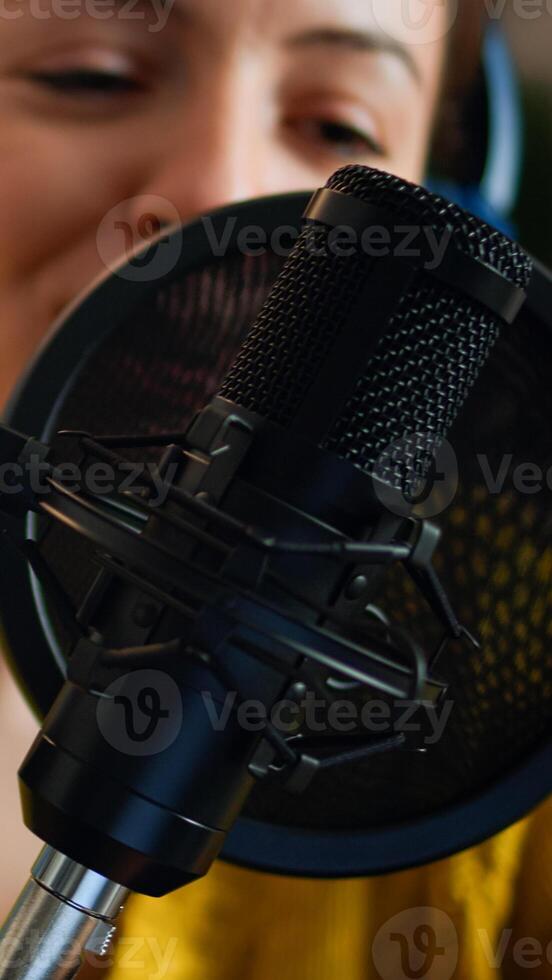 Creative show vlogger presenter recording sound in home studio for podcast. On-air online production internet broadcast show host streaming live content for digital social media using internet web photo