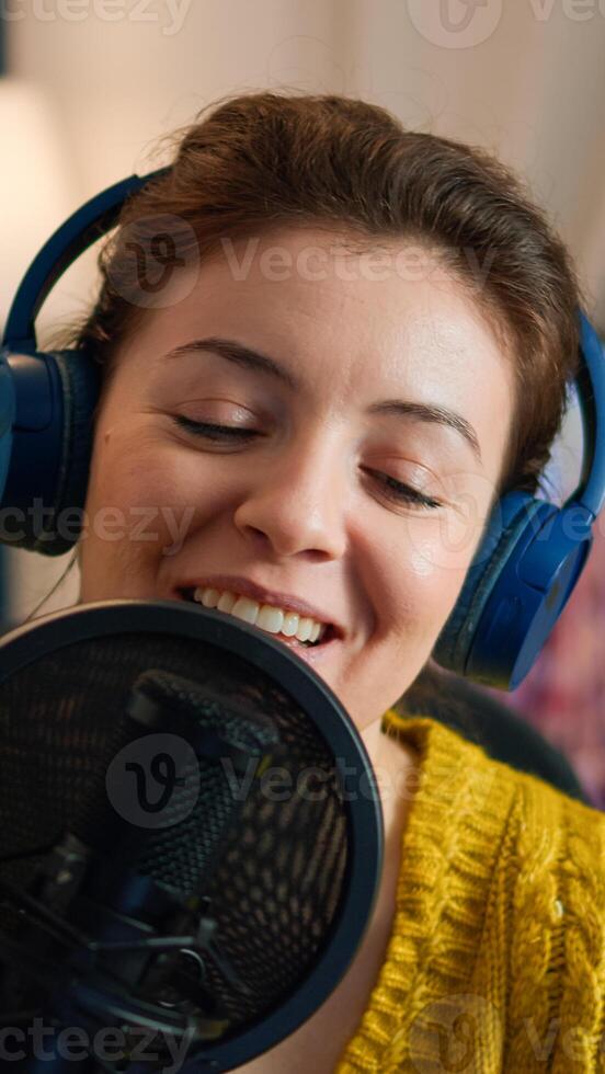 Close up of blogger talking on podcast microphone during streaming, new vlog series. On-air online production internet broadcast show host live content, recording digital social media communication photo