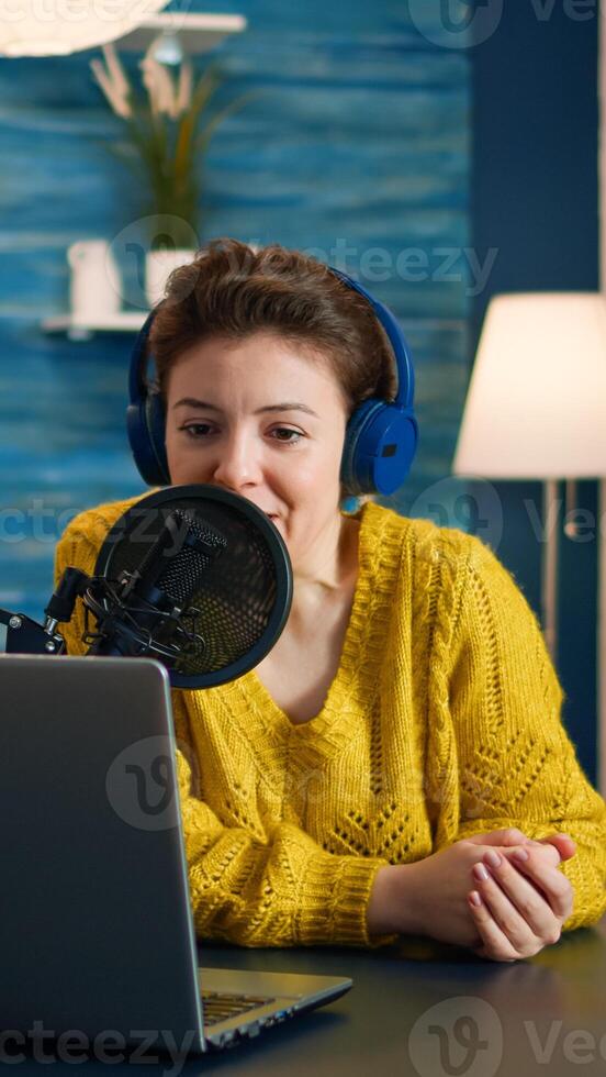 Blogger speaking with followers on live podcast using headphones. Creative online show On-air production internet broadcast host streaming live content, recording digital social media communication photo