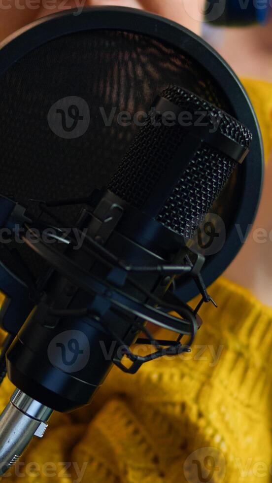 Close up of influencer discussing with fallowers during live on social media recording vlog. On-air online production internet broadcast show host streaming live content, blogger during livestreaming photo