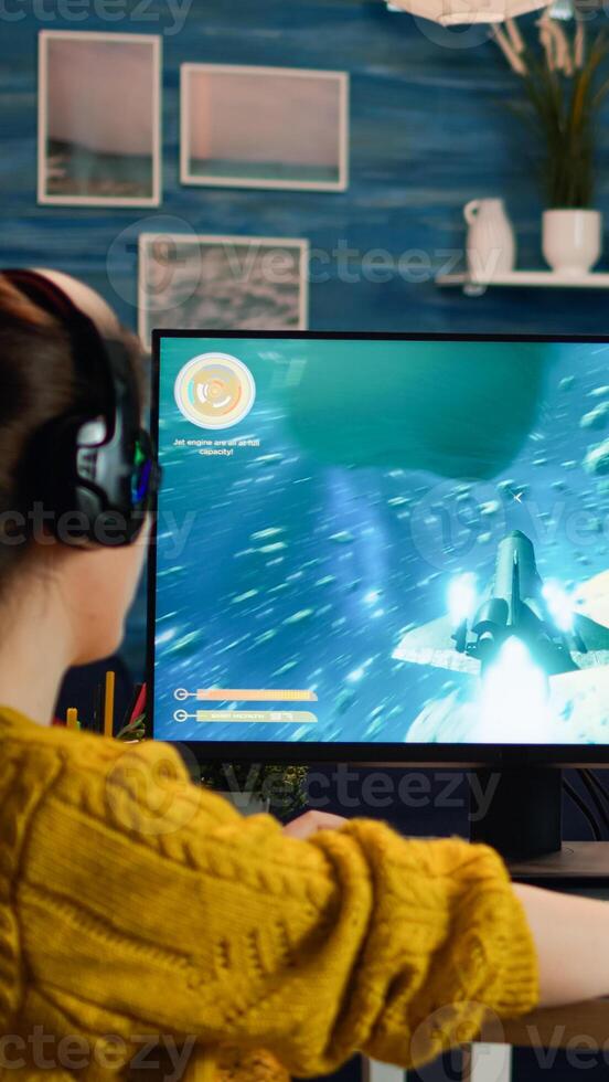 Professional esports gamer playing shooter mock-up game with new graphics and lots of actions. Pro esport team player streamer playing gaming tournament on powerful RGB computer, using modern streaming technology photo