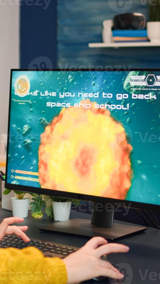 Angry professional gamer because it's game over for her during an online championship. Champion player testing online games on her personal computer with modern technology network wireless. photo