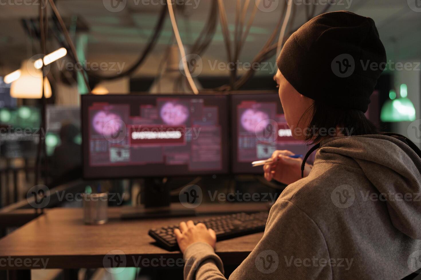 Male criminal reading system hacked alert on pc, getting access to computer database and corporate server. Man hacking profesional network, cyber security. Data breach, and malicious software attack. photo