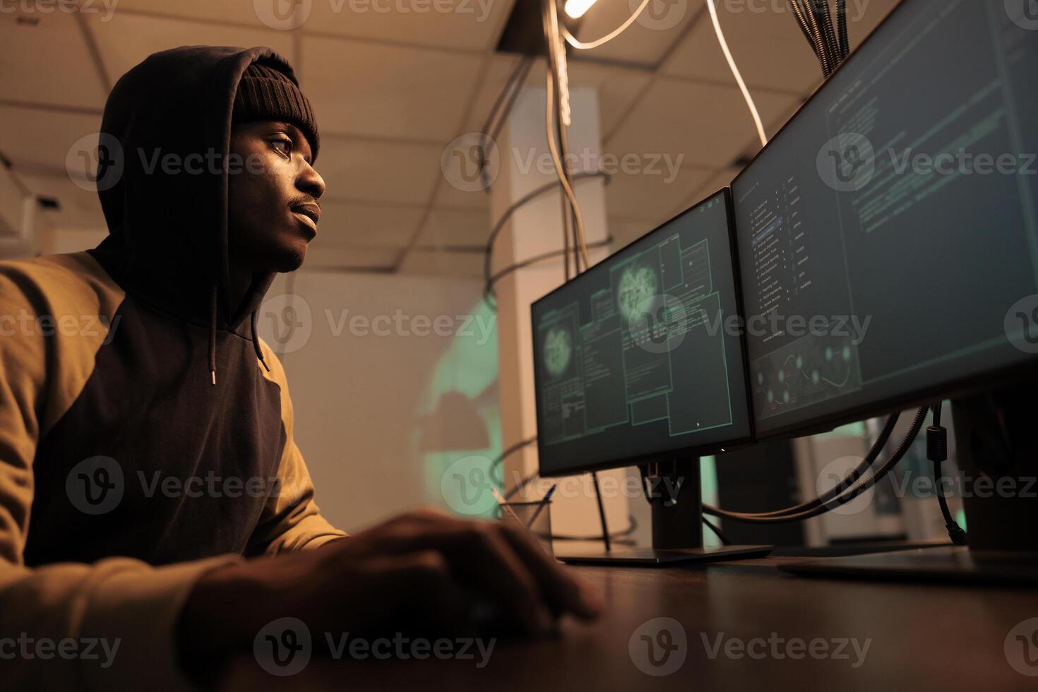 IT cybercriminal using malware and trojan virus to break into government system at night, using security breach to steal sensitive data. Male thief accessing server and cracking system encryption. photo