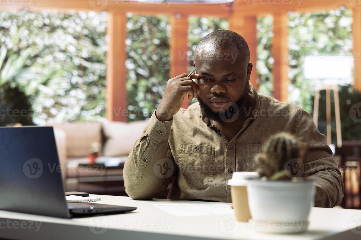 Businessman evaluating blueprints and adding layout measurements, planning business investment strategy with real estate leasing. Collaborating with contractors for office space inspiration. photo