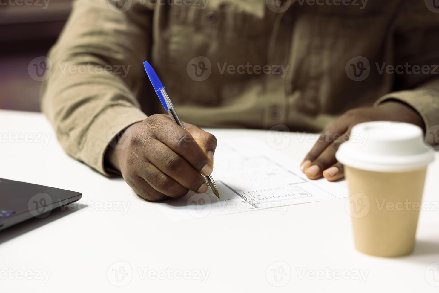 Business owner measuring new office space layout on architectural blueprints, working on sketches after a collaboration with contractors. Hunting for creative workspace investment. Close up. photo
