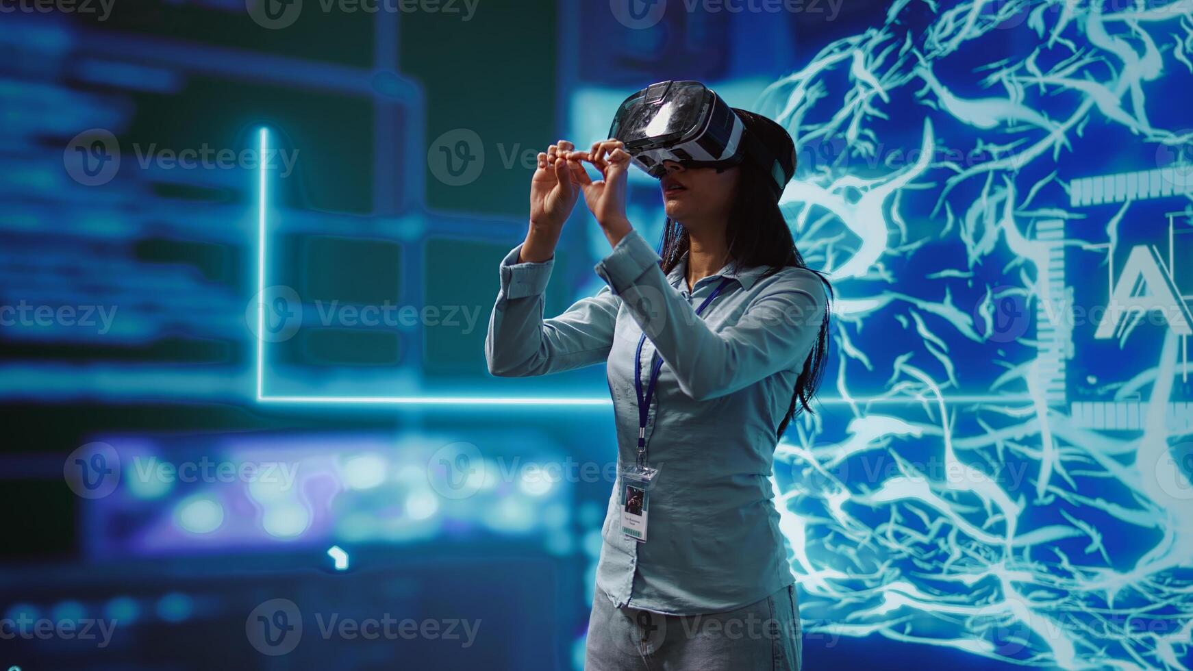 IT expert using VR headset, programming artificial intelligence computing simulating human brain. Technician uses virtual reality technology to build AI machine learning algorithms, camera B photo
