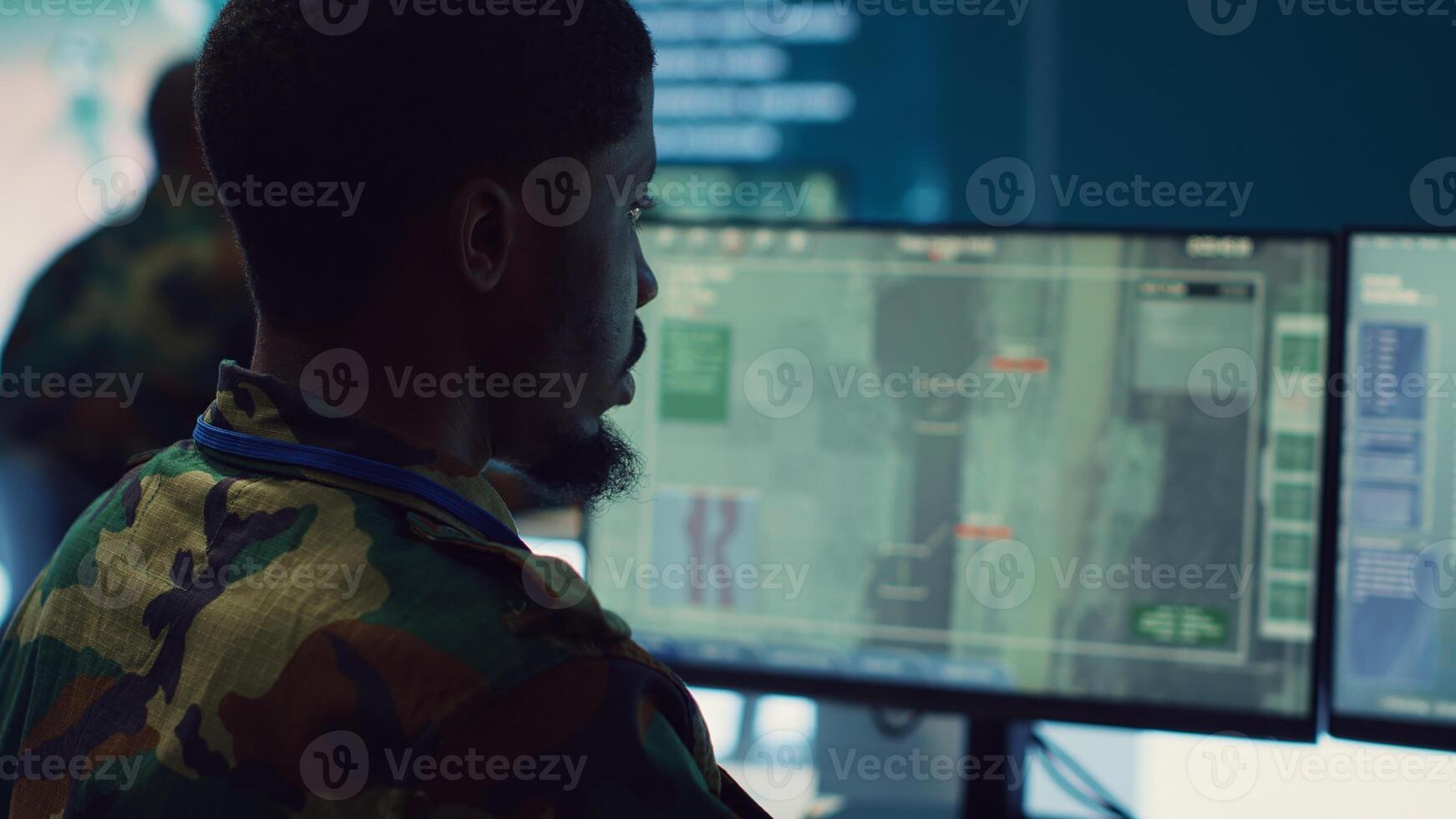 Soldier implements and processes tactical data with reconnaissance radar system, creating comprehensive battlefield maps to aid troops in the operational field. Intelligence for a mission. Camera A. photo