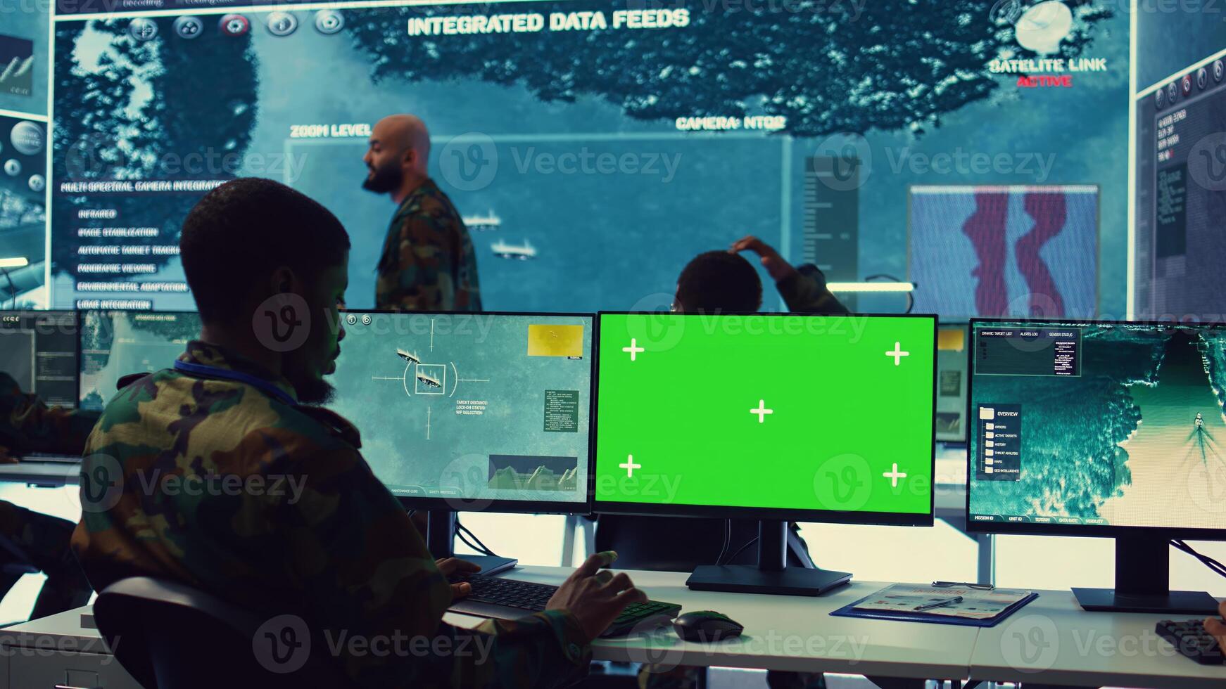 Private monitors national guard activity with military CCTV satellite system, working with a greenscreen display on pc in command center. IT reconnaissance operator tracking ships. Camera B. photo