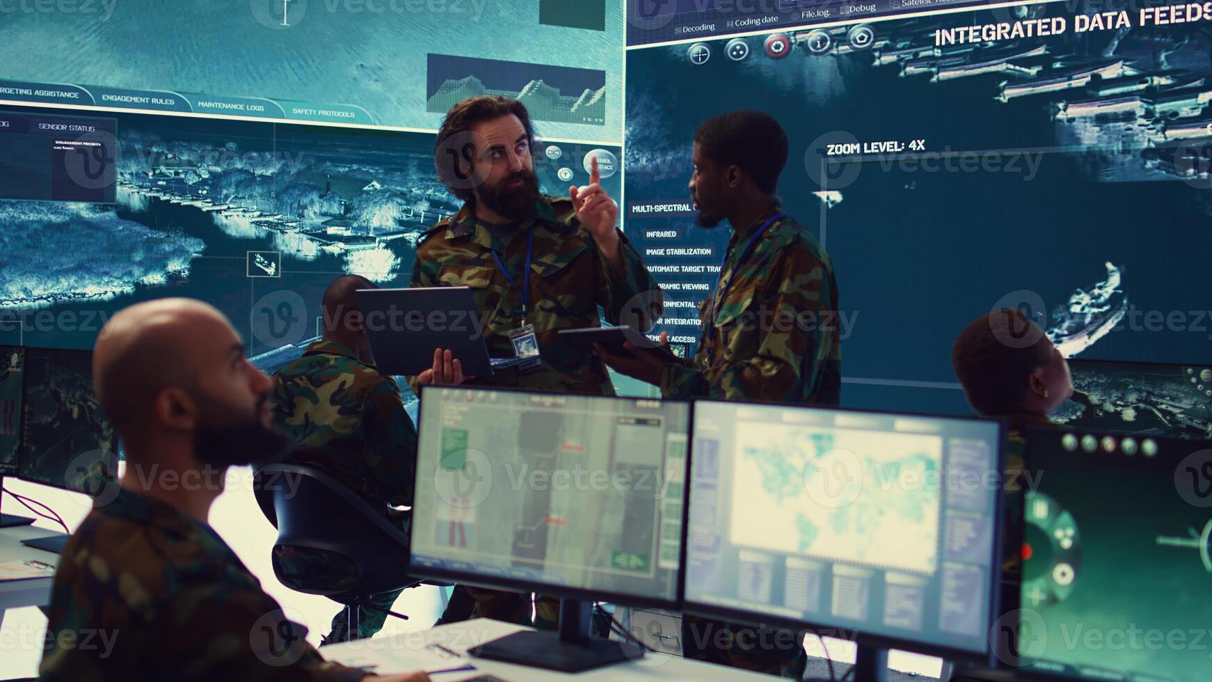 Officers team managing air traffic control for military aircrafts within the operational area, using CCTV radar surveillance. Evaluating and presenting mission plans to their crew. Camera B. photo