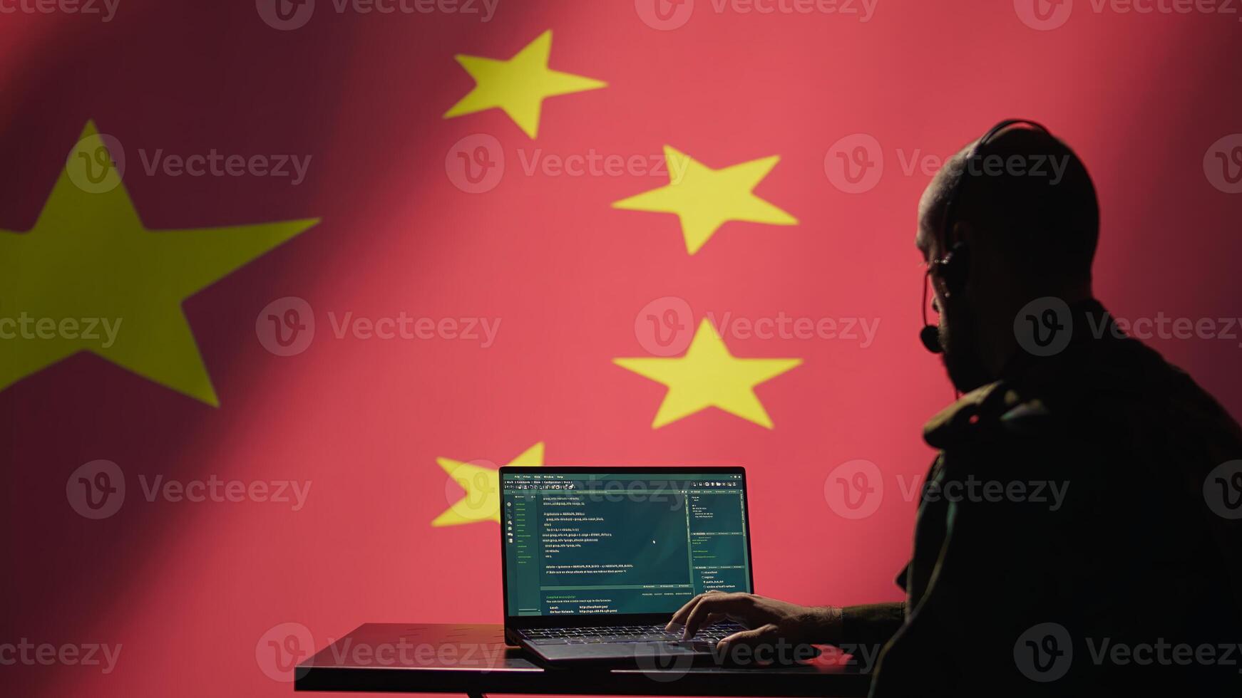 China military engineer creating fake accounts on social media to persuade other nations to act in the Chinese government interests. CCP intelligence operator spreading misinformation online, camera B photo