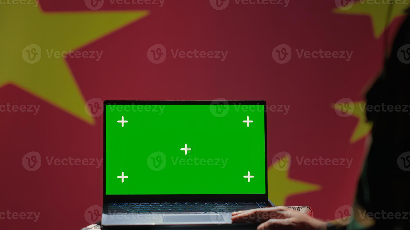 Chinese soldier using military tech on green screen laptop to identify threats from enemies. Army personnel using software on mockup notebook to communicate information to war front lines, camera A photo