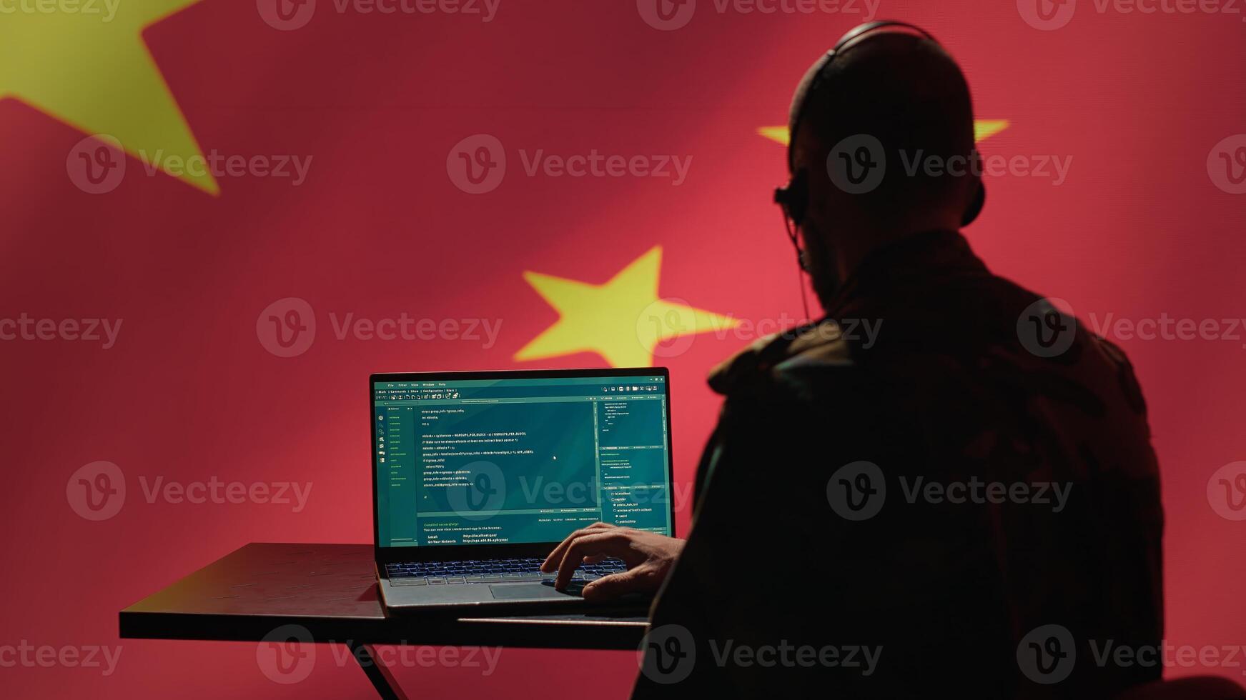 China military engineer creating fake accounts on social media to persuade other nations to act in the Chinese government interests. CCP intelligence operator spreading misinformation online, camera A photo