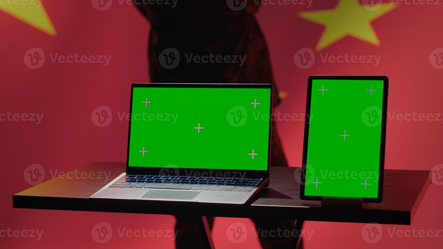 China army soldier using isolated screen laptop and tablet to identify threats from enemies. Army personnel using software on chroma key devices to relay info to war front lines, camera A photo