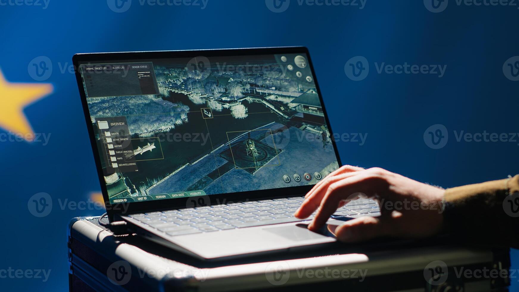 European Union using radar system on laptop to detect incoming ballistic missiles attacking member states. EU alliance army soldier scanning rockets approaching countries, deploying shields, camera A photo