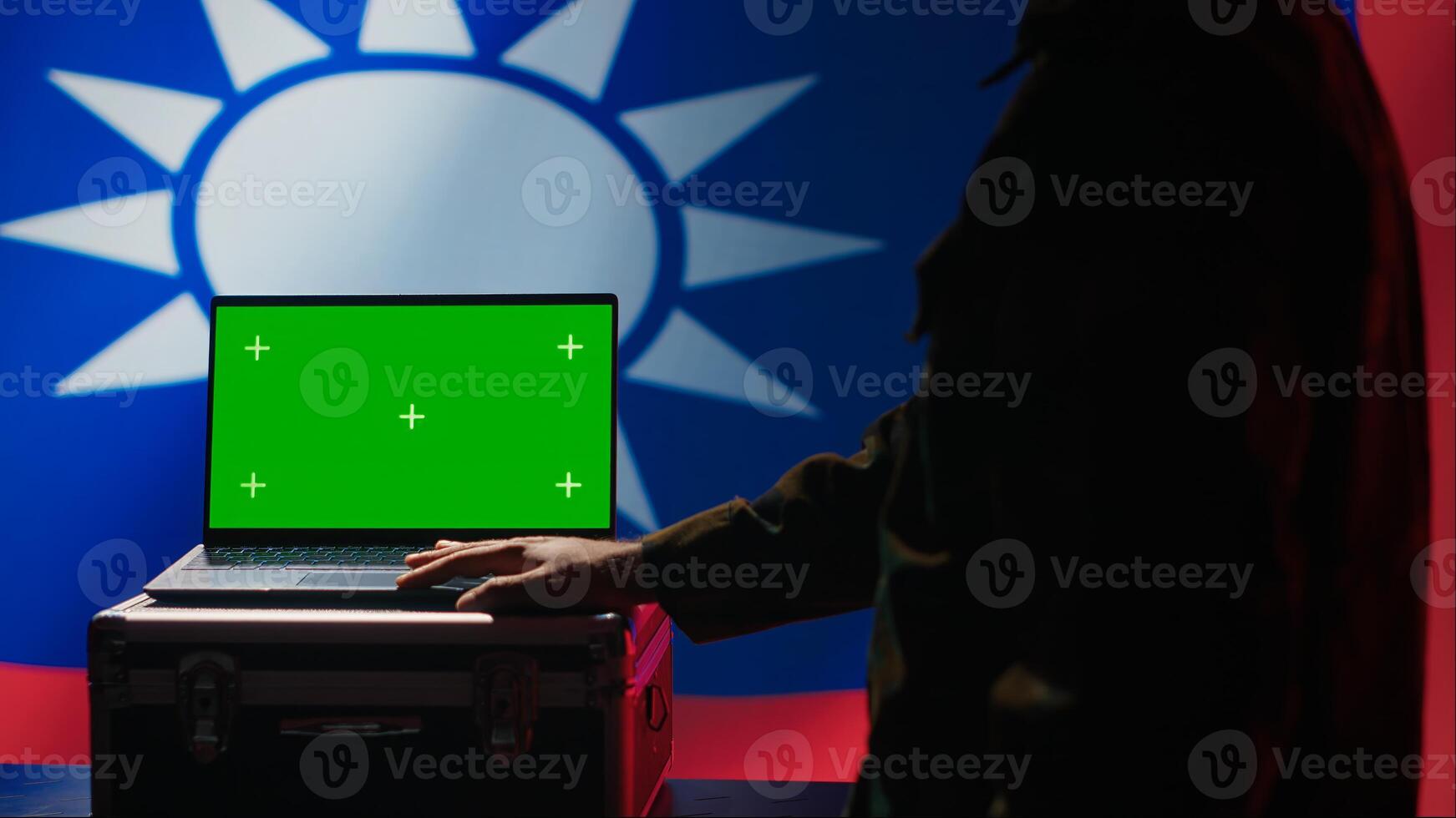 Taiwan specials ops unit uses green screen laptop to counteract Chinese propaganda promoting CCP One China policy. Taiwanese insurgent advocates for independence online using mockup notebook, camera A photo