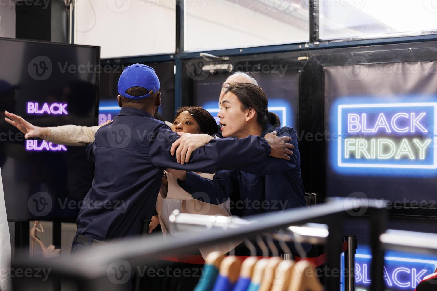 Black Friday crowd control. Anxious frenzied people shoppers near the store entrance during seasonal sales, waiting to start shopping in clothing store and get best deals first photo