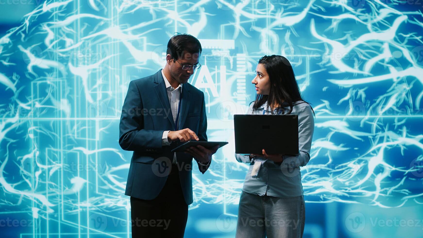 Teamworking colleagues using AI neural networks modeled after human brain to solve complex problems. Team of IT specialists using deep learning to look at data and complete tasks, camera A photo