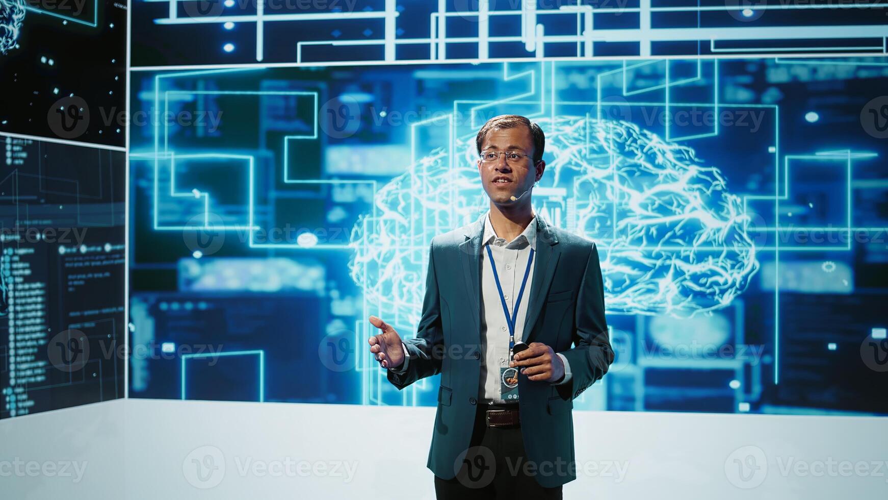 Jolly engineer using artificial intelligence computing simulating human brain thought processes. Portrait of upbeat Indian employee working with AI machine learning algorithms, camera B photo