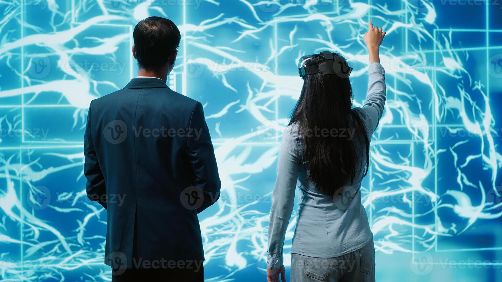 Engineers use VR headset and AI neural networks modeled after human brain to solve complex problems. IT experts using artificial intelligence and virtual reality tech to look at data, camera A photo