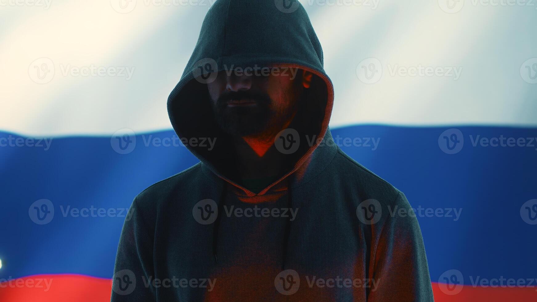 A maniacal russian hacker creating cyber threat alert by holding a skull as concept of cyber espionage and malicious code. Illustration warning of cyber security risks, evil harmful scam. Camera A. photo