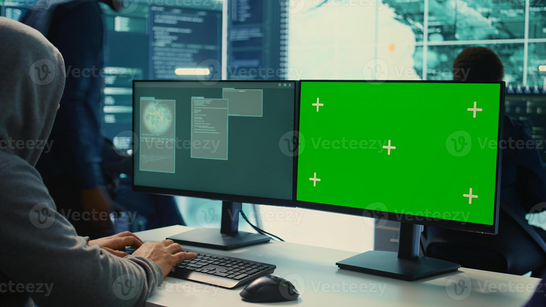 Professional team of governmental hackers conducting cyber surveillance, looks at isolated copy space screen. Expert examines cybersecurity measures and online security in high tech agency. Camera B. photo