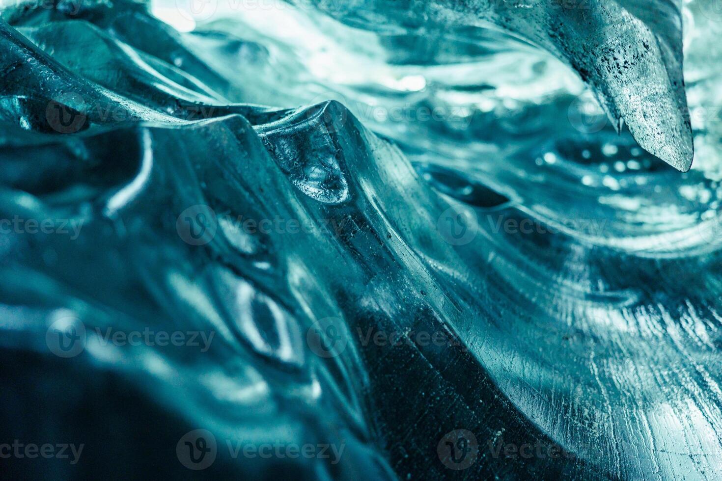 Blue ice cap in vatnajokull crevasse, massive transparent icy glacier in iceland. Inside ice caves with cracked ice rocks covered in frost, nordic landscapes with ice mass pathway. photo