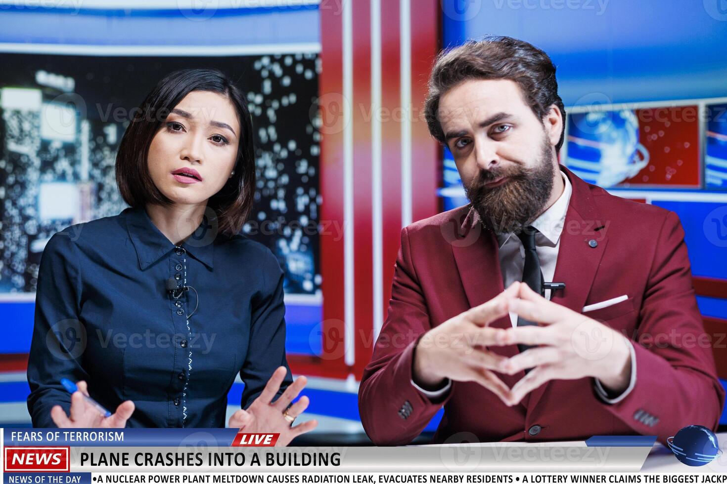 Presenters reveal terrorism danger as plane crashes into tall building, causing fear and madness among citizens. Newscasters team address airplane terrorist attack, worrying breaking news. photo