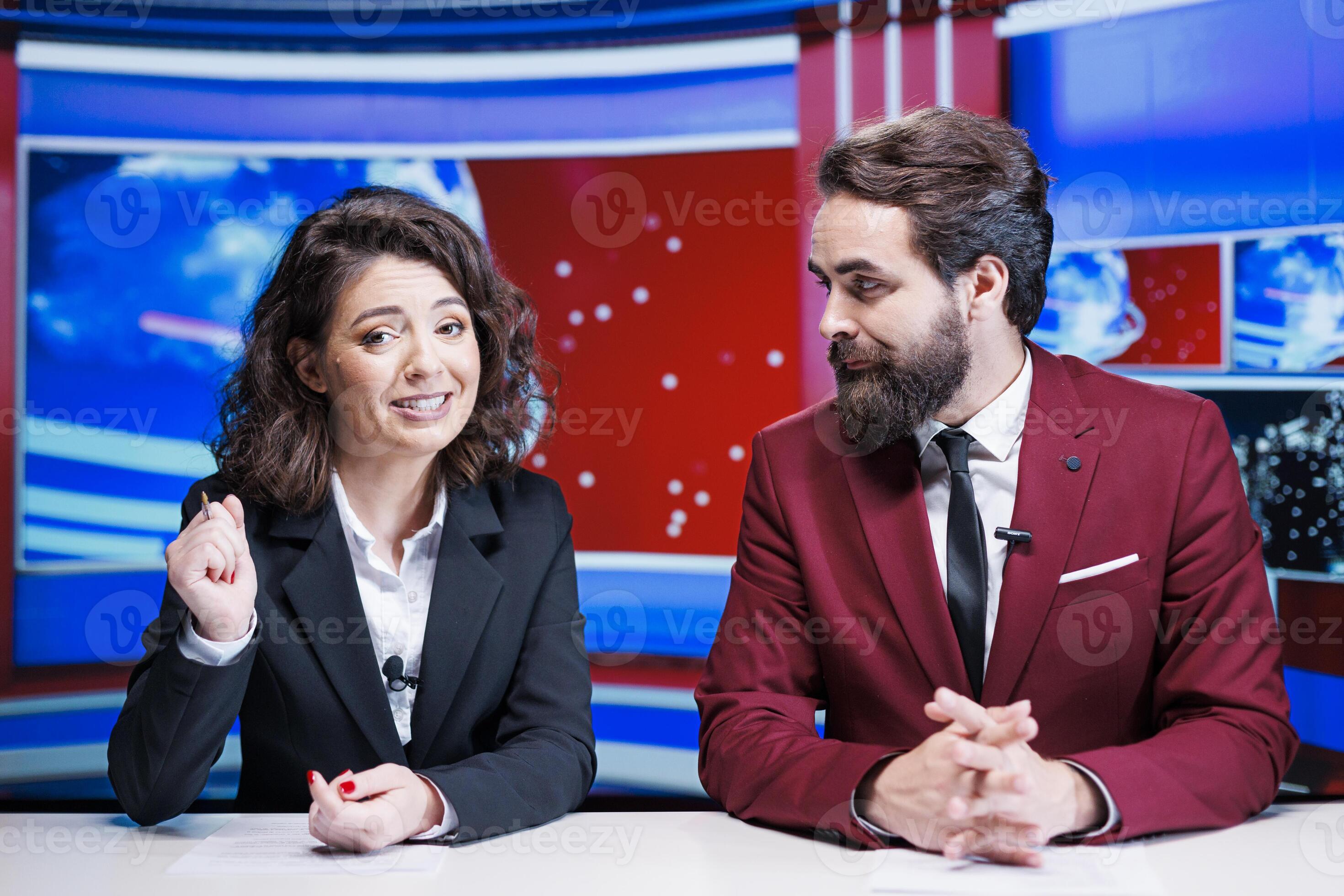 Team of presenters doing newscast live on tv channel broadcasting