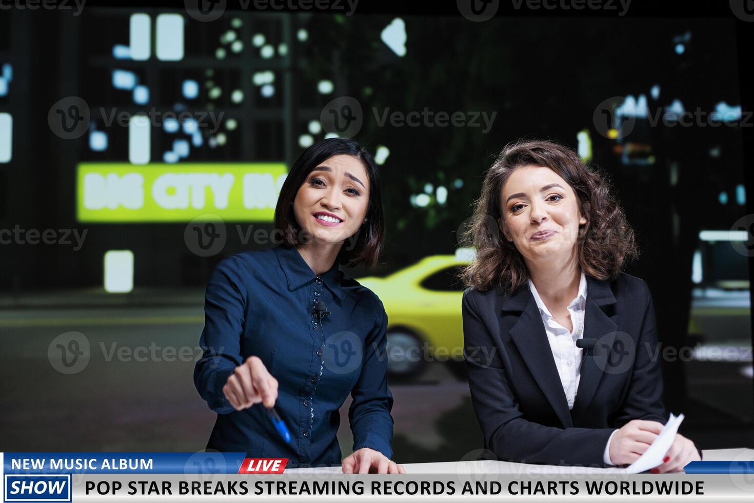 Reporters announce new music from artist, album release breaks streaming records and top charts. Diverse women presenting breaking news in entertainment and media segment of night show. photo