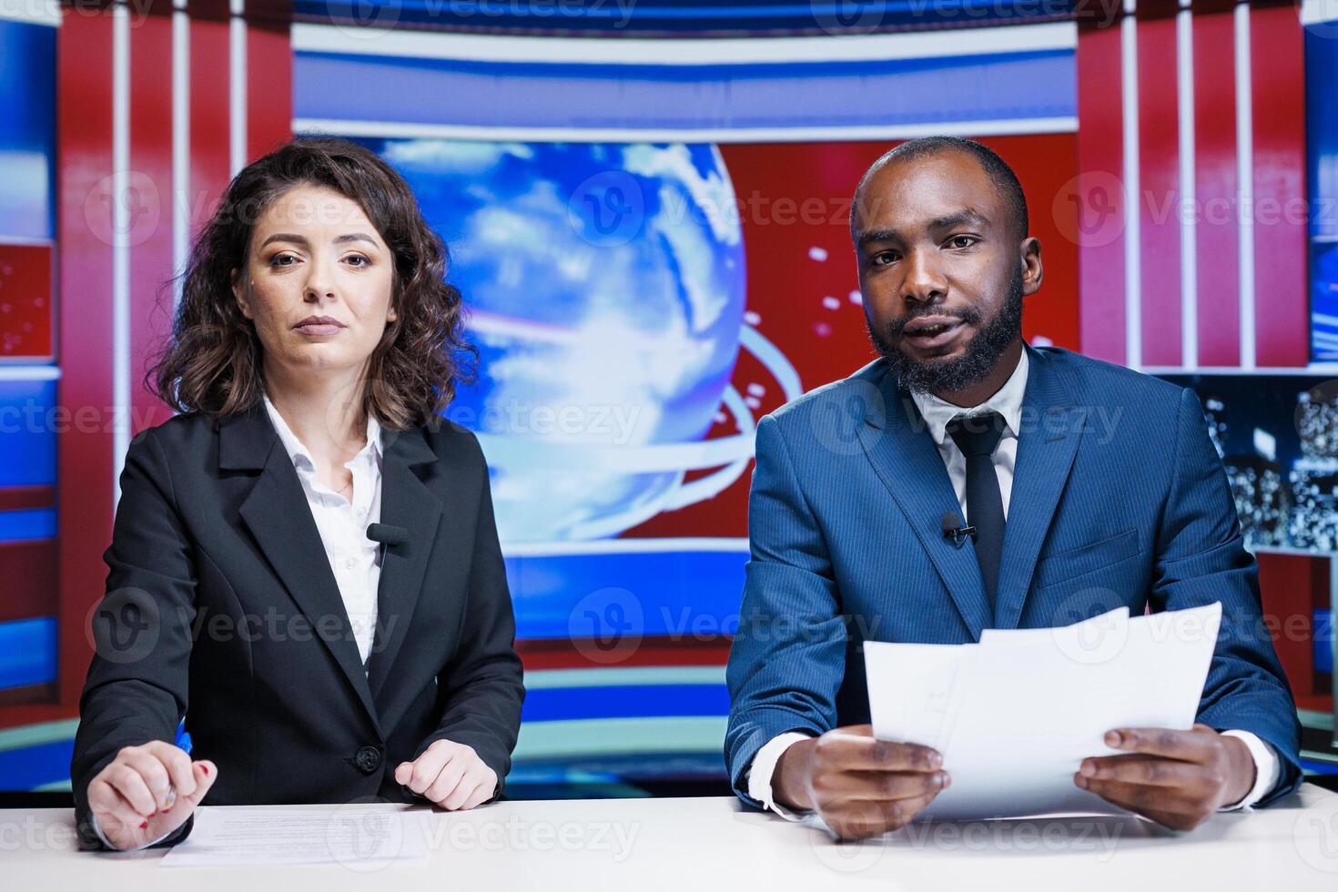 Diverse broadcasters doing reportage live on television channel, hosting morning show in media studio. Team of news presenters discussing about latest interest topics with information from headlines. photo