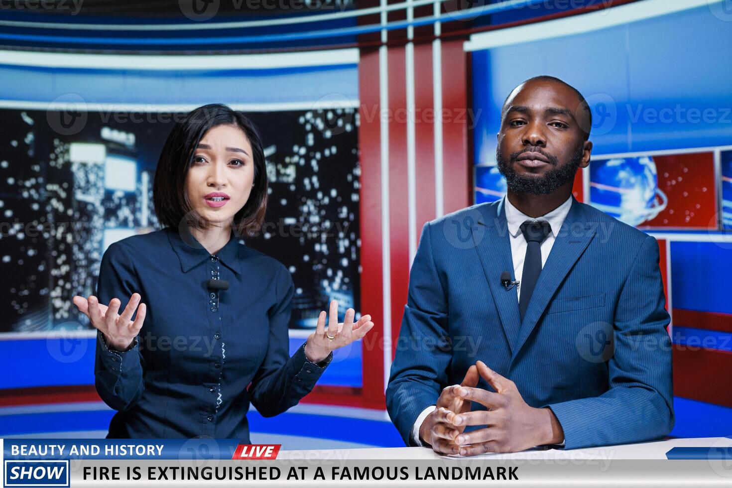 Newscasters announcing fire hazard at famous landmark, firefighters stopping flames from destroying history and beauty. Presenters team doing television reportage on night show live. photo