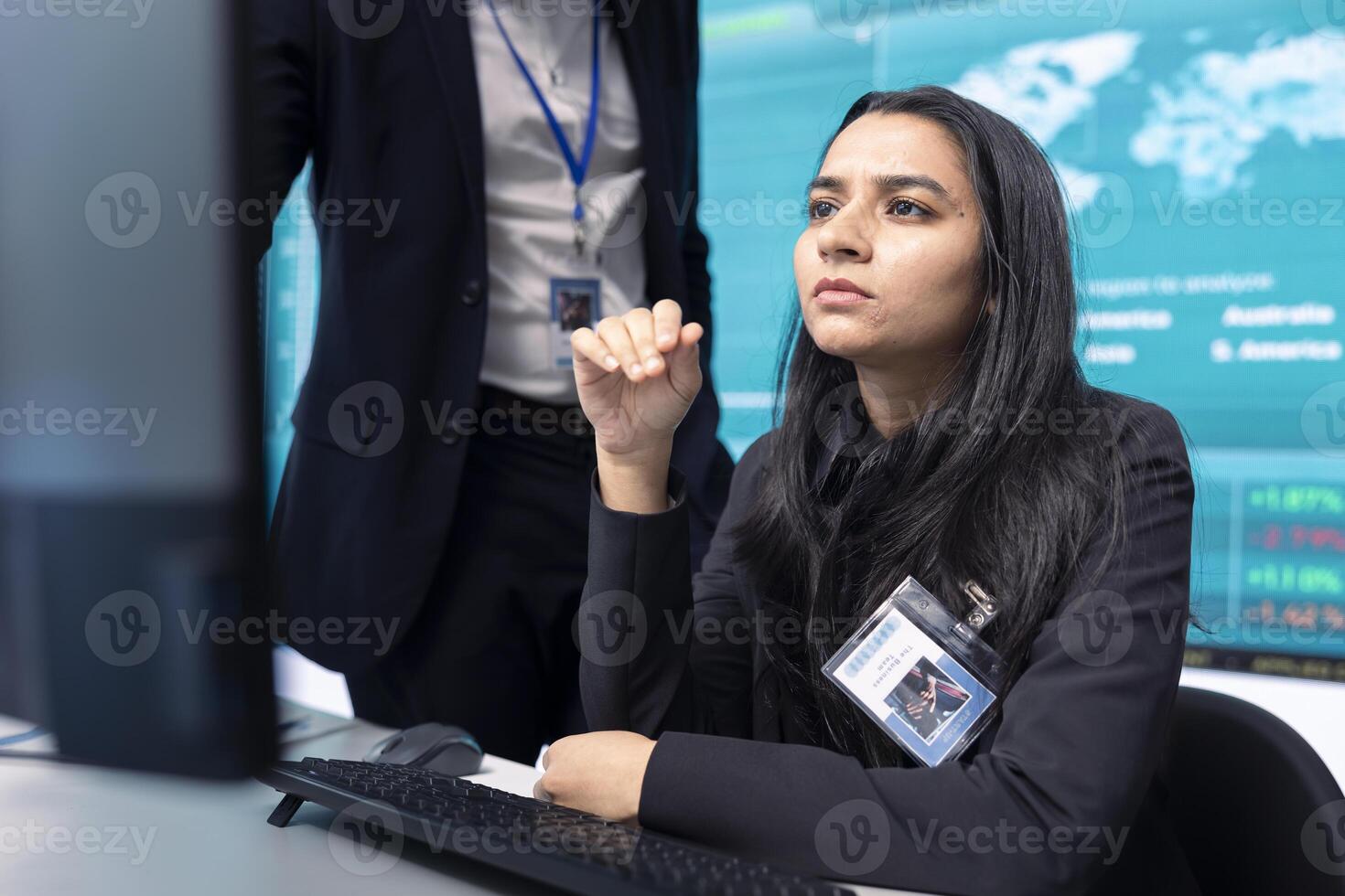 Team of analysts calculating profit amount and making decisions to fund another organizational project, examine big data on a pc. Business associates verifying productivity and budget. photo