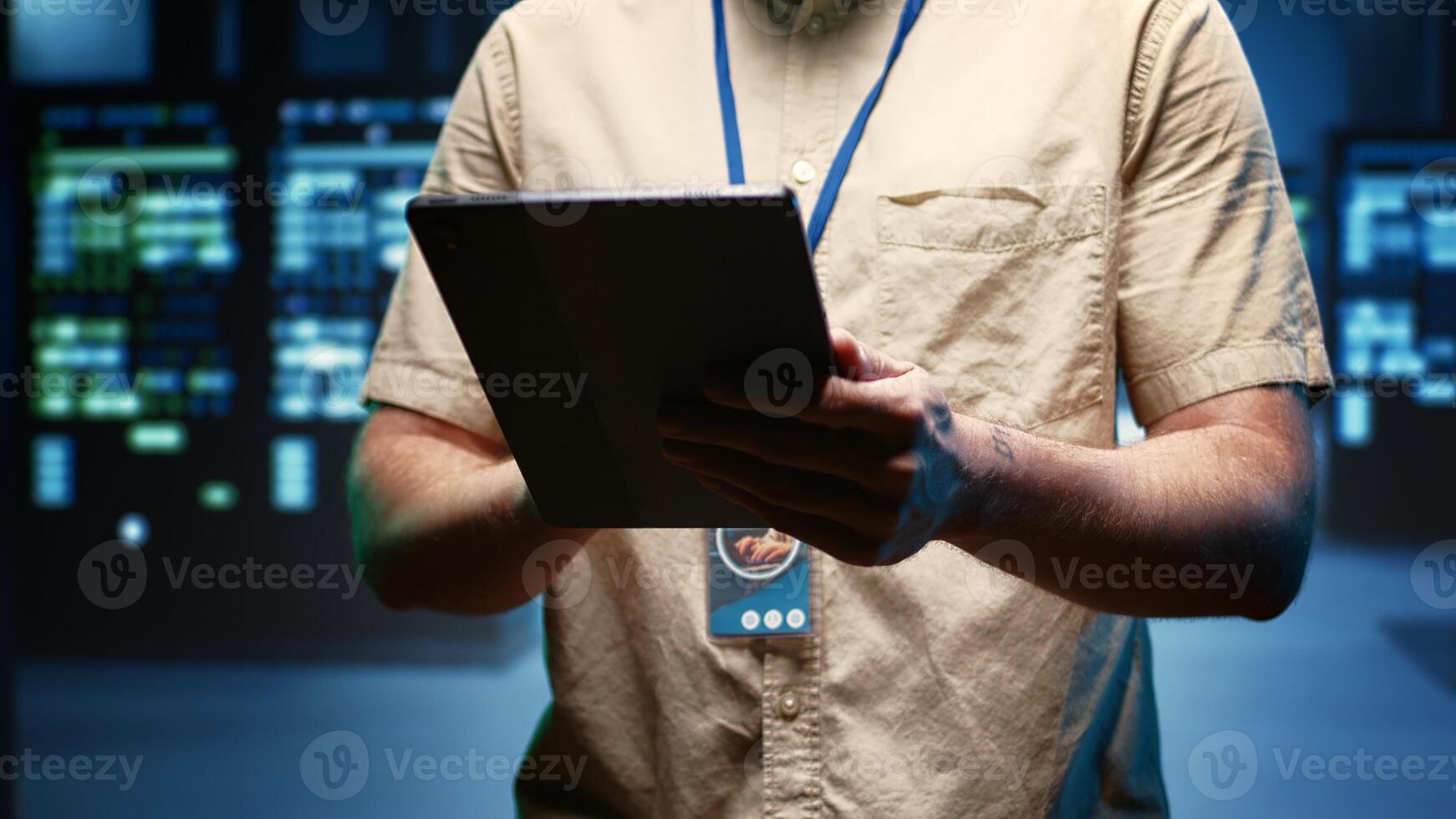 Engineer in data center providing dedicated VPN servers able to deliver enhanced security, privacy, encrypted sensitive data, online anonymity, secure internet connections, sufficient fast speed bandwidth to users photo