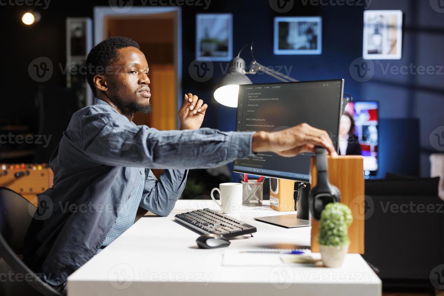 System admin generating IT scripts for data centers and developing program in machine language. On HTML terminal window, engineering specialist typing code in binary, ensures server security. photo
