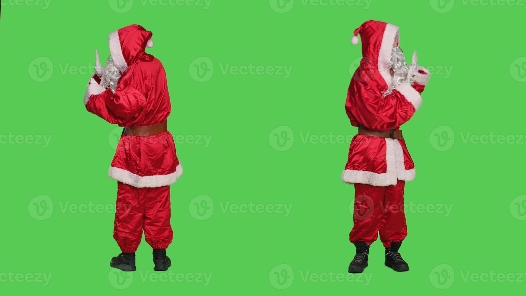 Saint nick pretends to push object aside, wearing december seasonal character red suit and hat. Santa claus character pushing something in rejection, refusing thing over full body greenscreen. photo