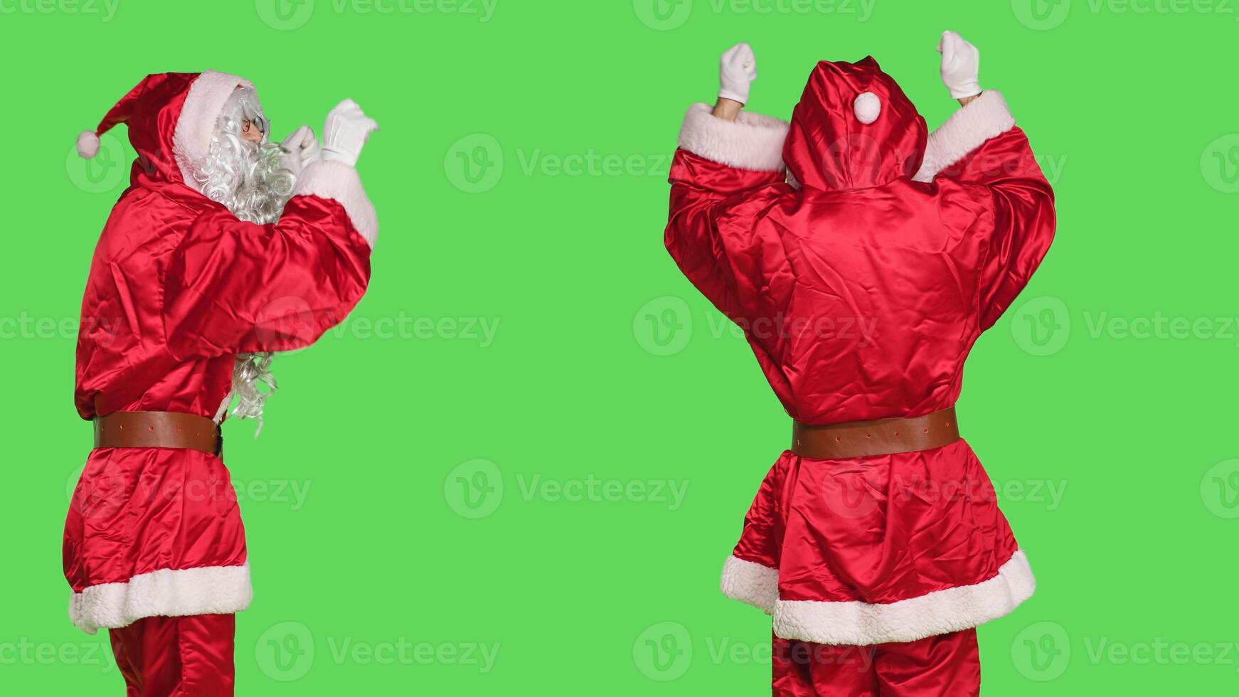 Saint nick musician conducting orchestra, choirmaster in costume accompany choir notes over greenscreen backdrop. Santa acting like musical director, musician singing in studio. photo