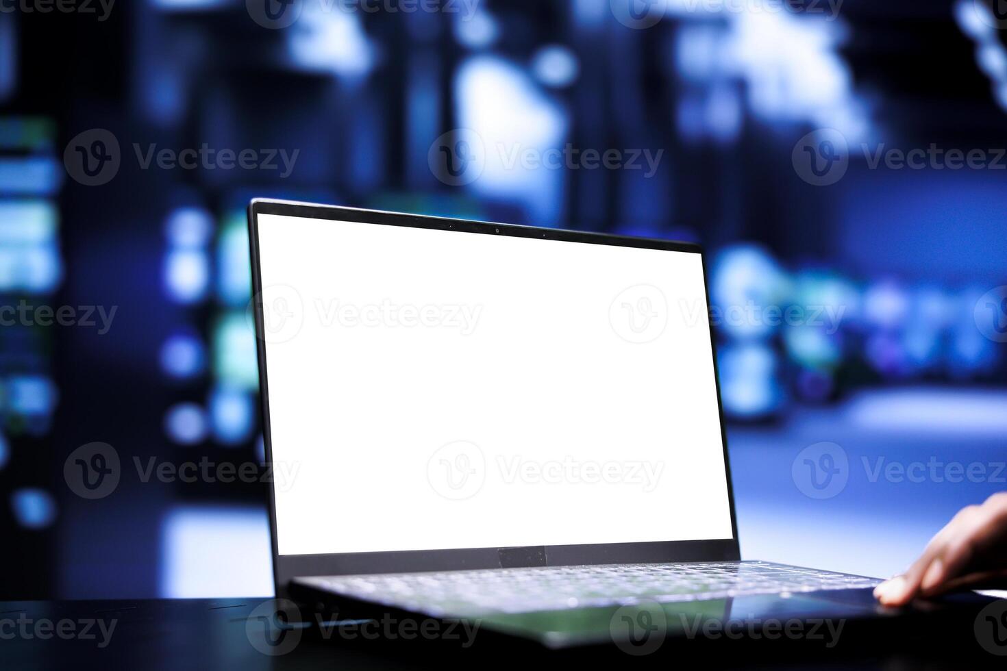 Hardworking expert using mock up laptop for server racks maintenance helping businesses manage databases, host websites and store files. Engineer monitoring data center equipment, close up photo