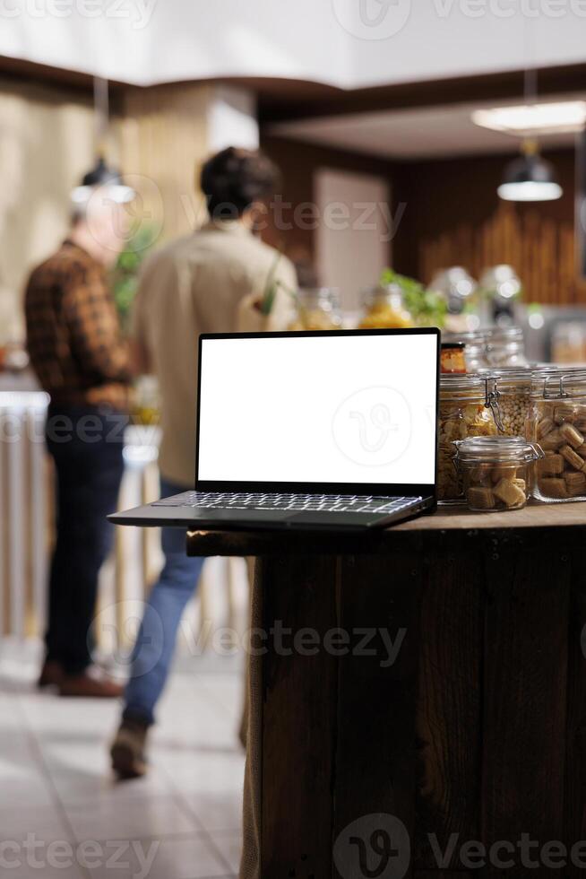 Mockup tablet with empty copy space used as commercial sign in environmentally responsible zero waste supermarket. Isolated screen device in chemicals free food store acting as promotional message photo
