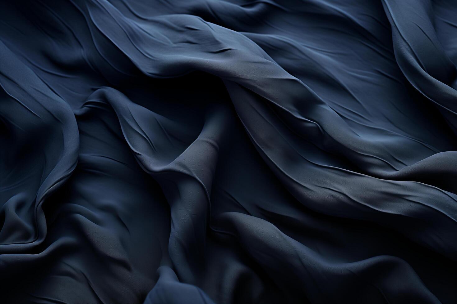 A close-up of dark fabric with deep wrinkles and soft lighting, highlighting the intricate folds and texture. photo