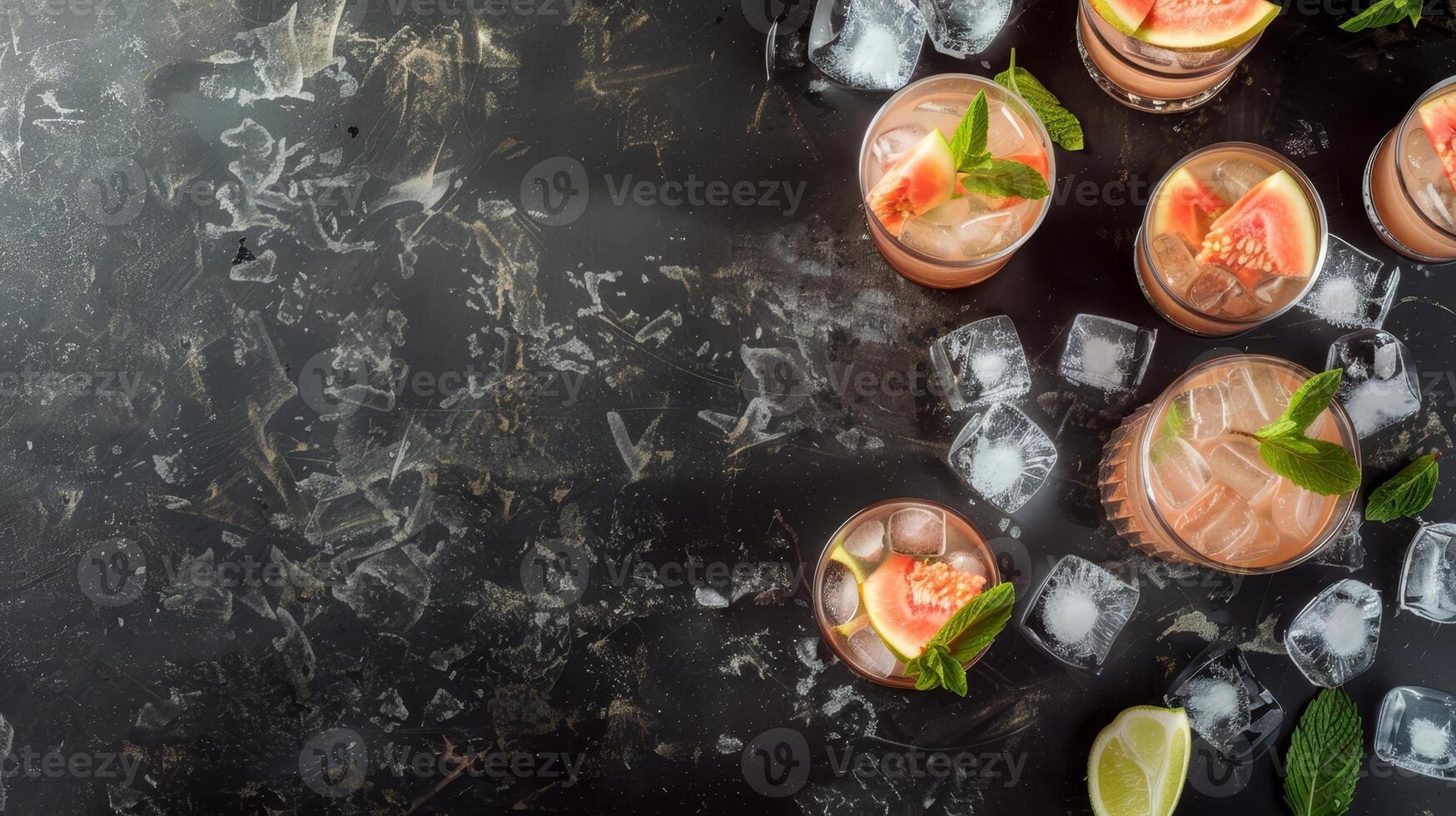 Top view of Paloma cocktail in glasses with tropical guava fruit and ice cubes . Summer vacation illustration with copy space on dark background. Perfect for summer menus and restaurant business photo